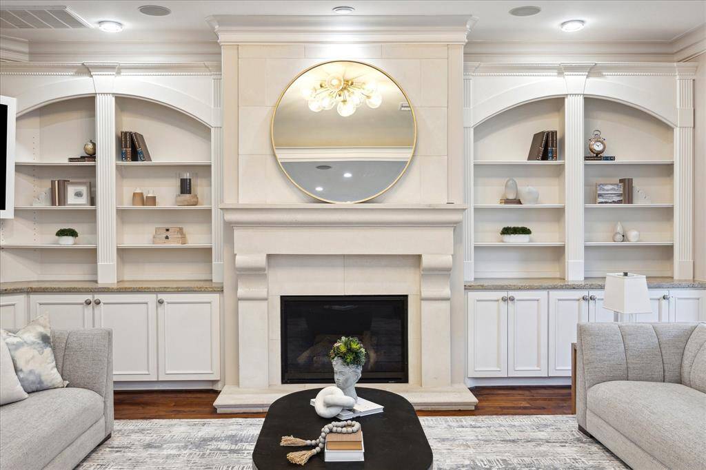 Intricate millwork includes fluted, egg-and-dart, and rope detailing.