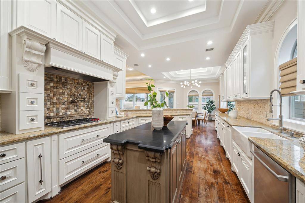 Well-equipped with built-in appliances, granite counters, and a functional layout, the island kitchen provides an ideal space for creating culinary masterpieces.  Custom furniture-grade cabinetry was refurbished in February 2025.