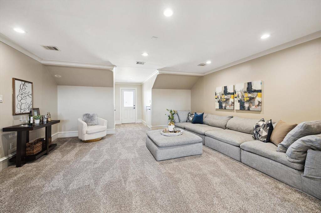 Sized 29' x 38', this impressive third-floor retreat includes a game room, media room, and bedroom.