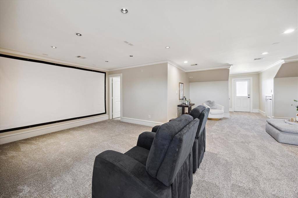 Through the door to the back is a balcony with freshly-painted iron railing and new flooring.  Imagine the possibilities—and memory-making experiences—with a versatile space like this.