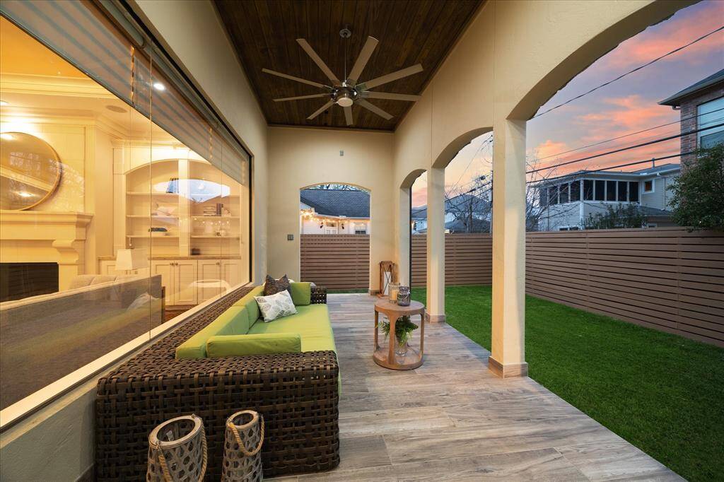With a 12' ceiling, gas outlet, and views of the back yard—large enough for a pool—the covered patio offers options for outdoor living and entertaining.