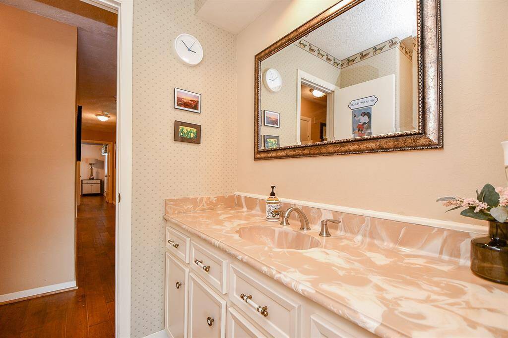 Secondary bathroom with cultured marble counter tops