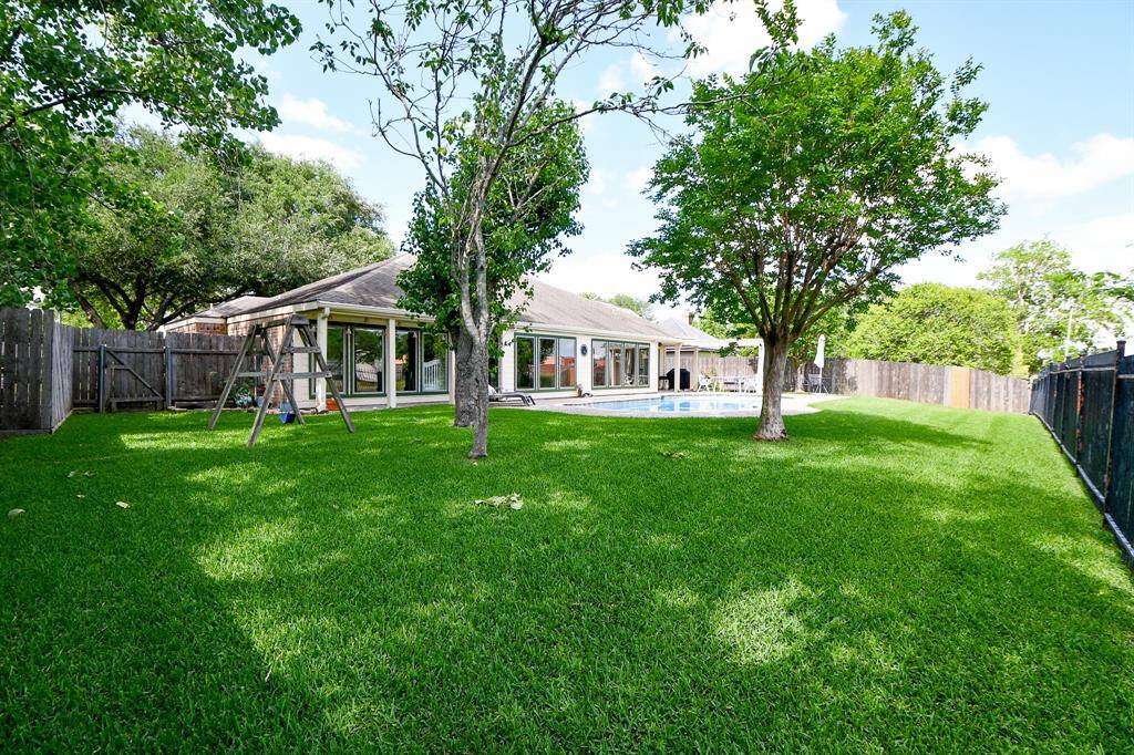 Large backyard with view of the creek. Iron fencing and no backyard neighbors