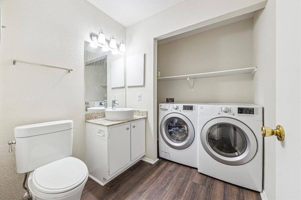 Half bath houses full size washer & dryer.