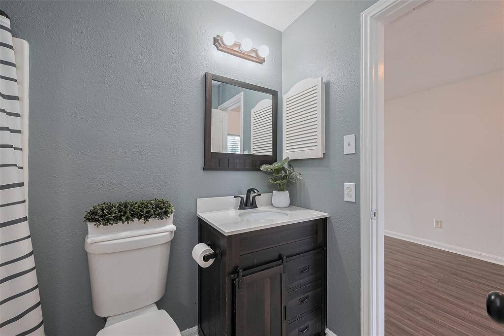 Bathroom with combo shower and tub