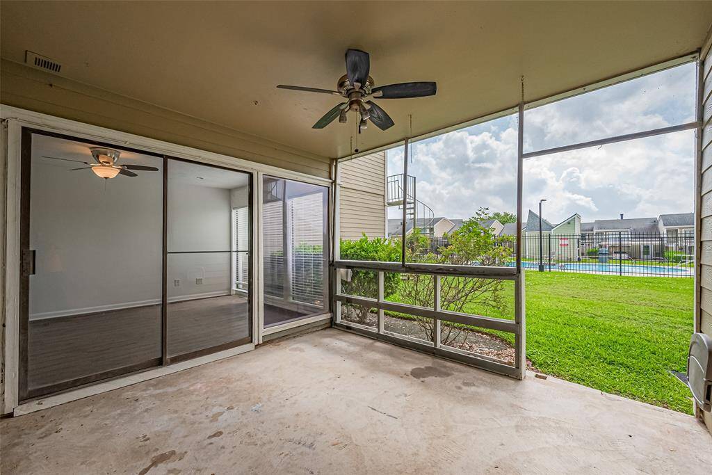 Screened in patio overlooking community pool