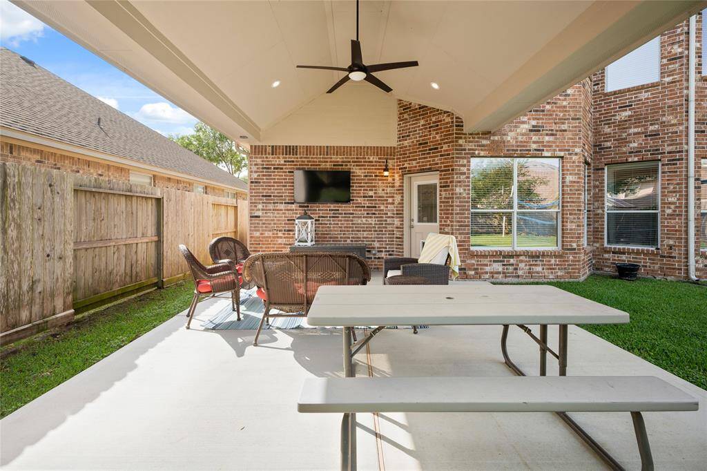 Patio with custom recess lighting and fan install