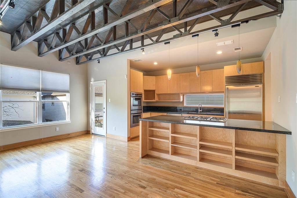 Breakfast / Den just off the kitchen,breakfast bar and door to spiralstaircase/small balcony that goes downto the fenced backyard.