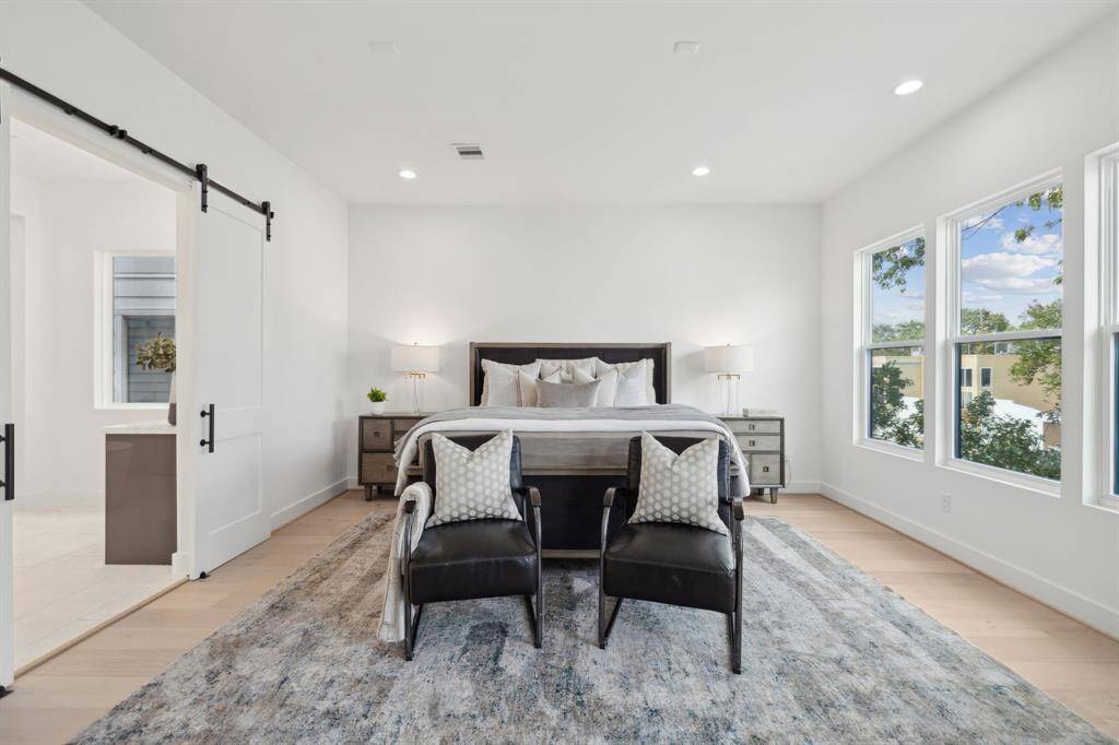 The second floor primary suite is spacious and secluded.