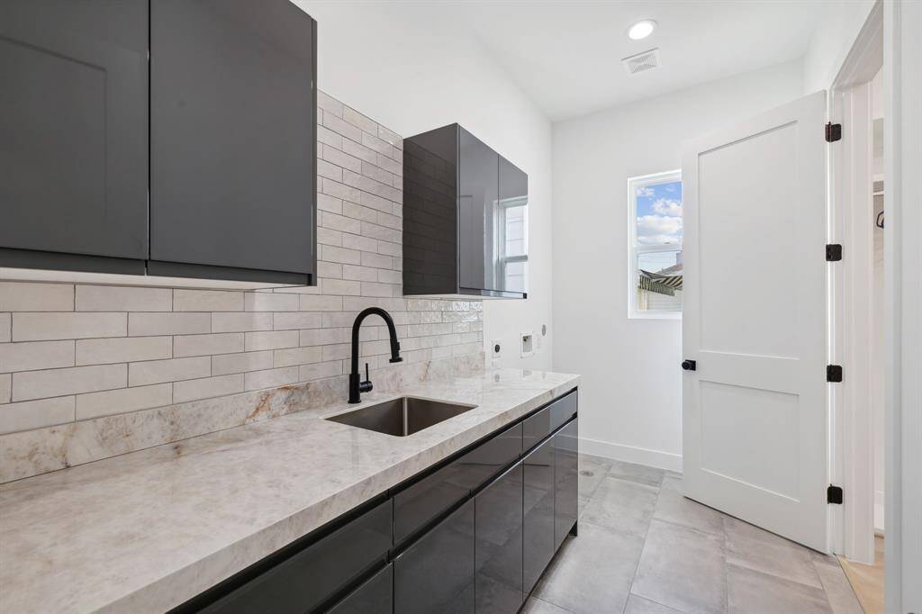 Laundry room conveniently connected to the primary bath.