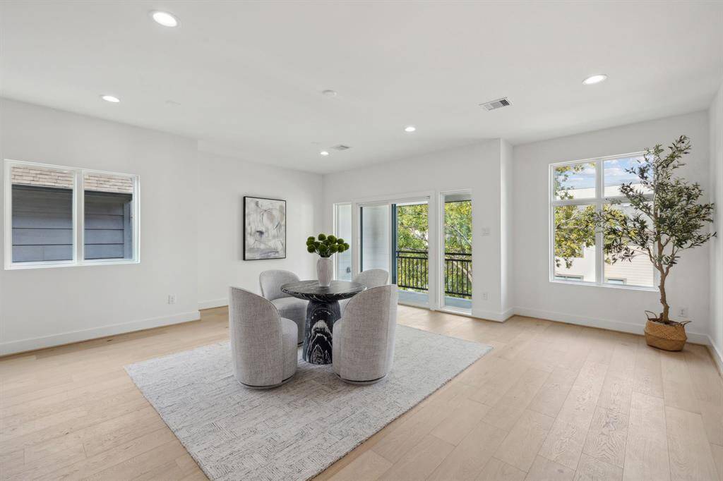 Numerous windows flood the space with natural light.
