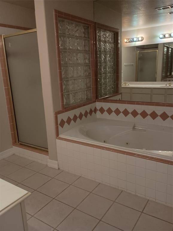 Primary Bathroom with separate shower and bathtub
