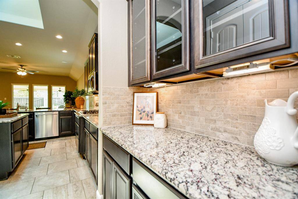 View of butler's pantry leading to kitchen.
