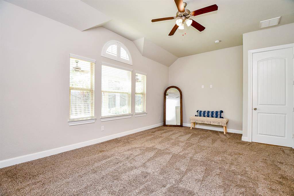 Large primary bedroom with perfect furniture nook.