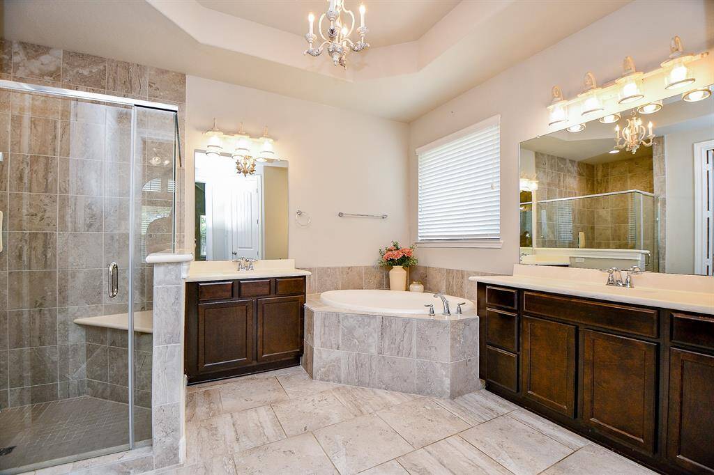 GORGEOUS primary bathroom with oversized shower, soaking tub and double sinks.