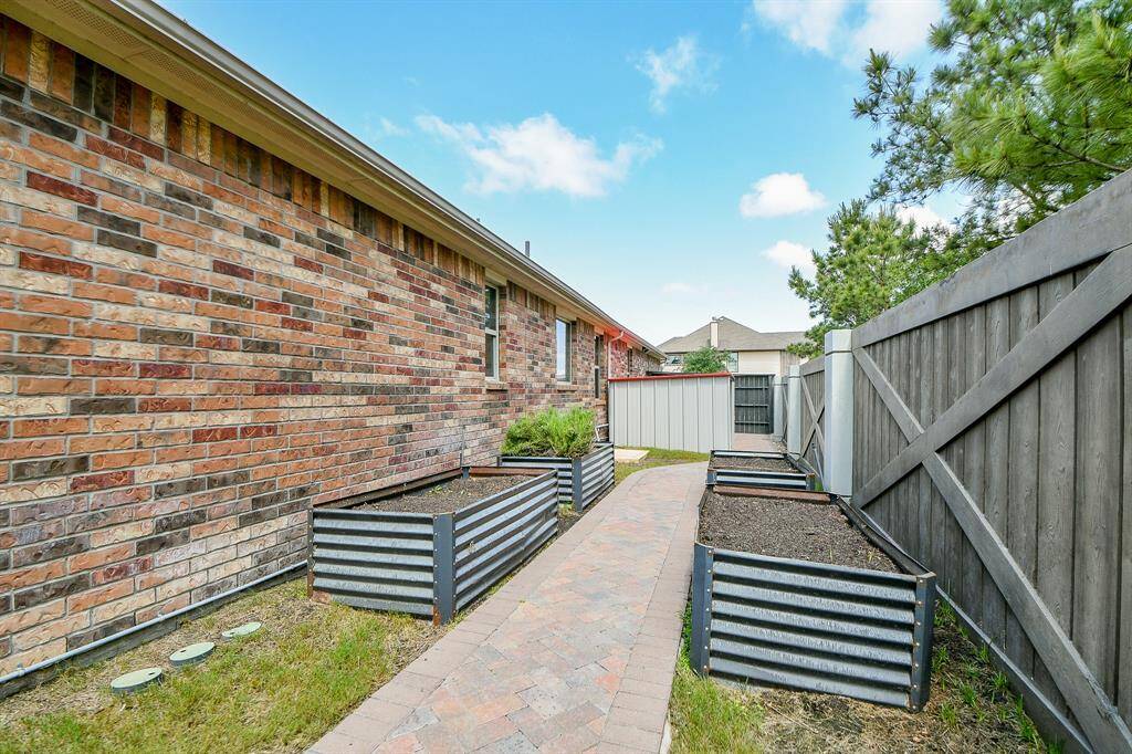 Custom paved walkway and garden boxes.