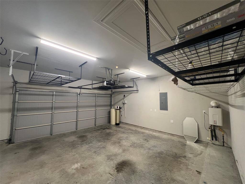 Cleaned out garage with ceiling storage on both sides. Garage door opener with MY Q.