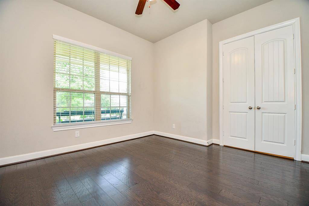 Work from home in this lovely office with a view, & nice wood floors.