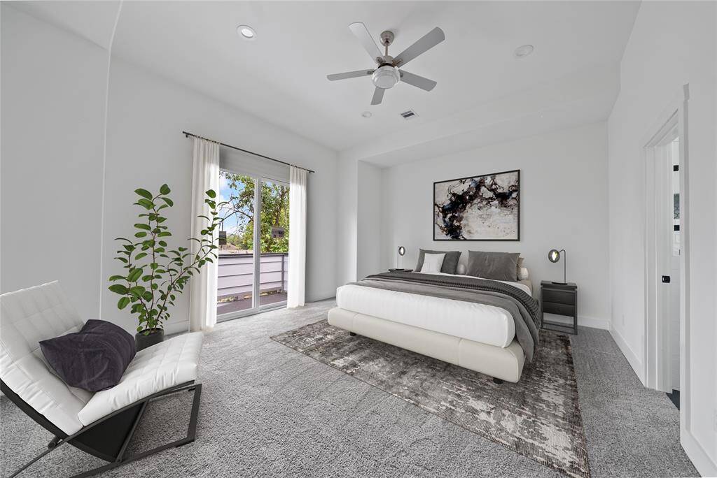 REPRESENTATIVE PHOTO - Virtually staged primary bedroom features a private balcony and luxurious bathroom.
