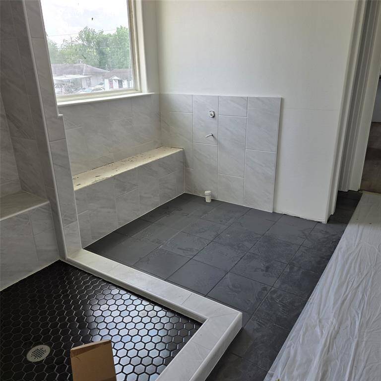 *ACTUAL PHOTO (under construction) - Primary bath upstairs with oversized shower and pedestal tub*