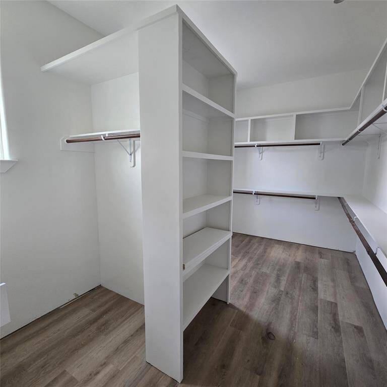 *ACTUAL PHOTO (under construction) - oversized closet in primary bedroom*