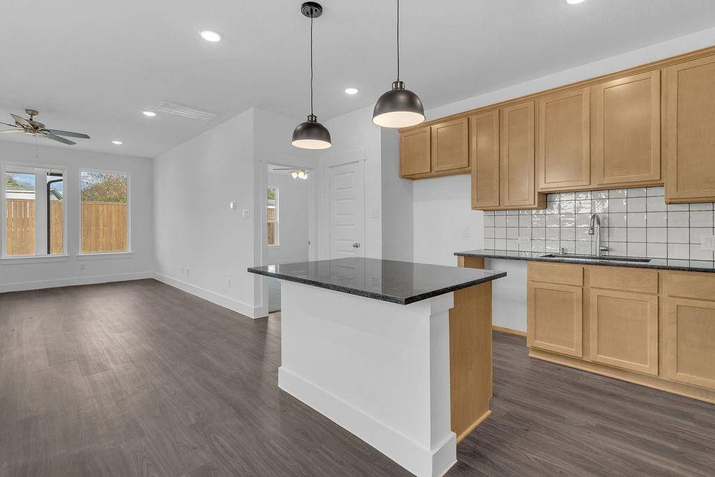 This kitchen isn’t just a place to cook; it’s a space where memories are made, where family traditions thrive, and where you can feel truly at home. Microwave, Dishwasher, Stovetop range are included, just not pictured.