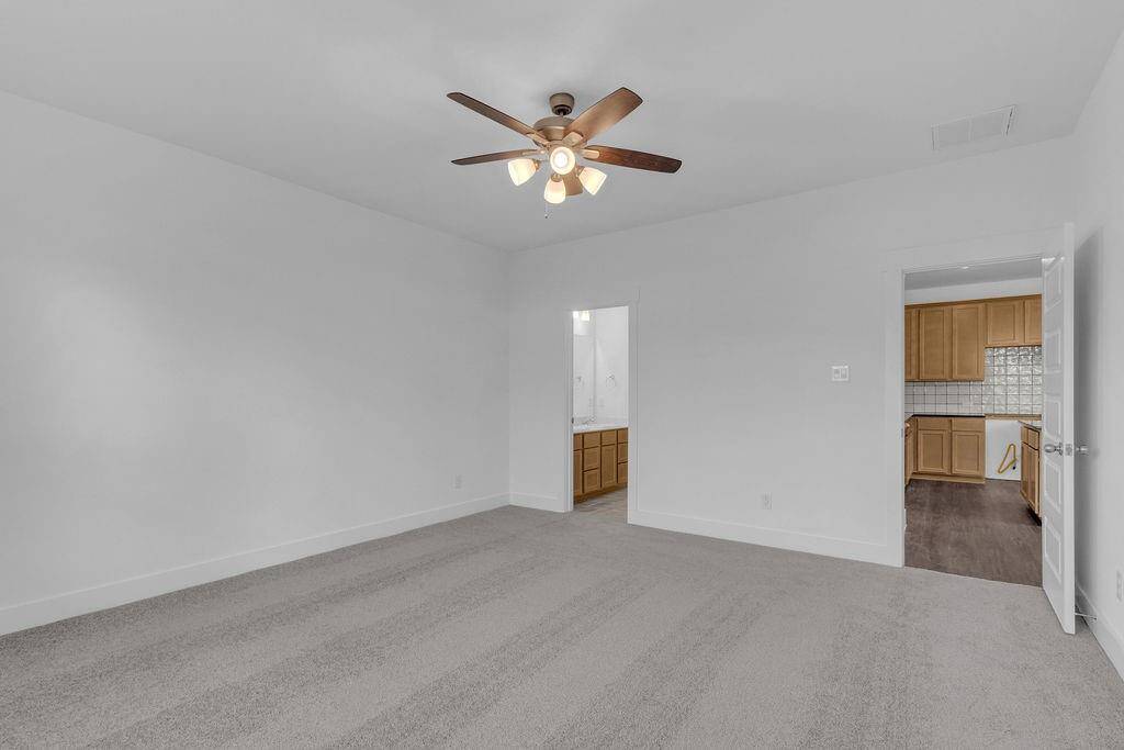 The spacious layout offers plenty of room for a plush king-sized bed, adorned with fluffy pillows and your favorite throws, inviting you to sink in and relax.