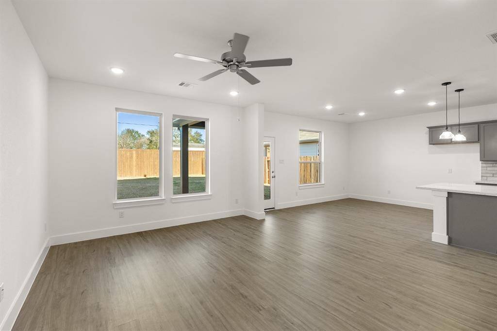 Picture cozy gatherings in a living area that encourages laughter, while the sleek kitchen—equipped with state-of-the-art appliances—beckons culinary adventures and family dinners.