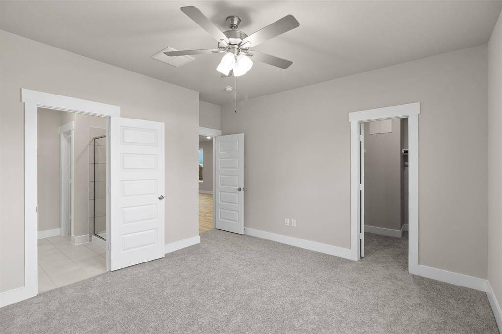 The spacious layout offers plenty of room for a plush king-sized bed, adorned with fluffy pillows and your favorite throws, inviting you to sink in and relax.