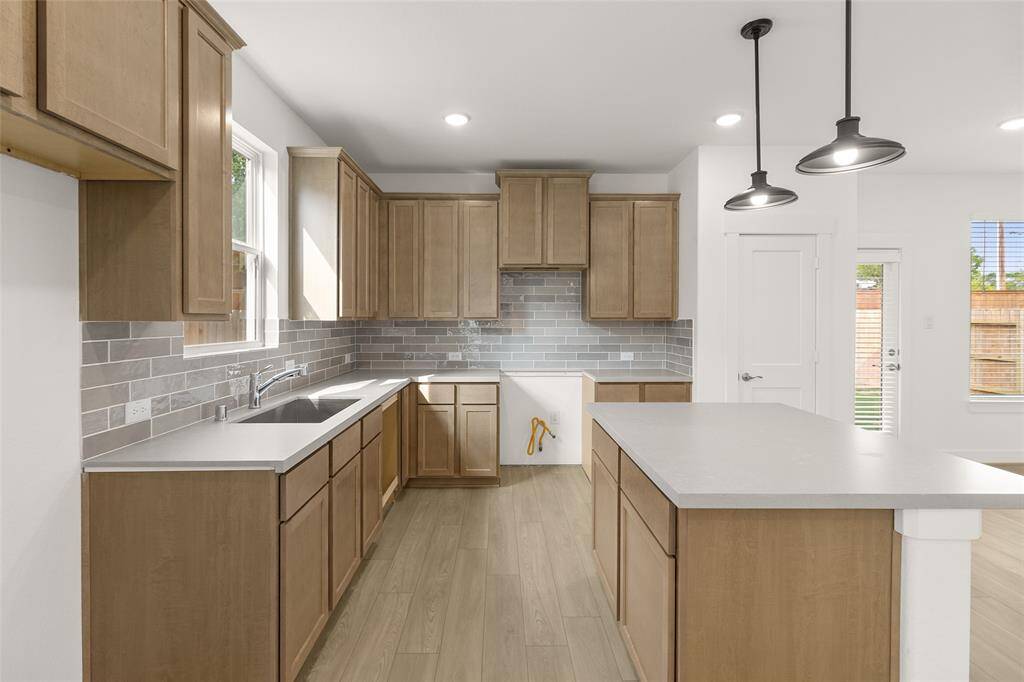 You can almost hear the sizzle of your favorite dish coming to life as you imagine yourself whipping up culinary delights in this dreamy kitchen. Microwave, Dishwasher, Stovetop range are included, just not pictured.
