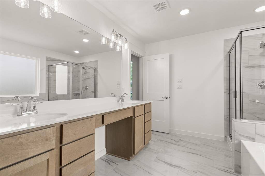 Enjoy the privacy of a well-appointed primary bath in your suite