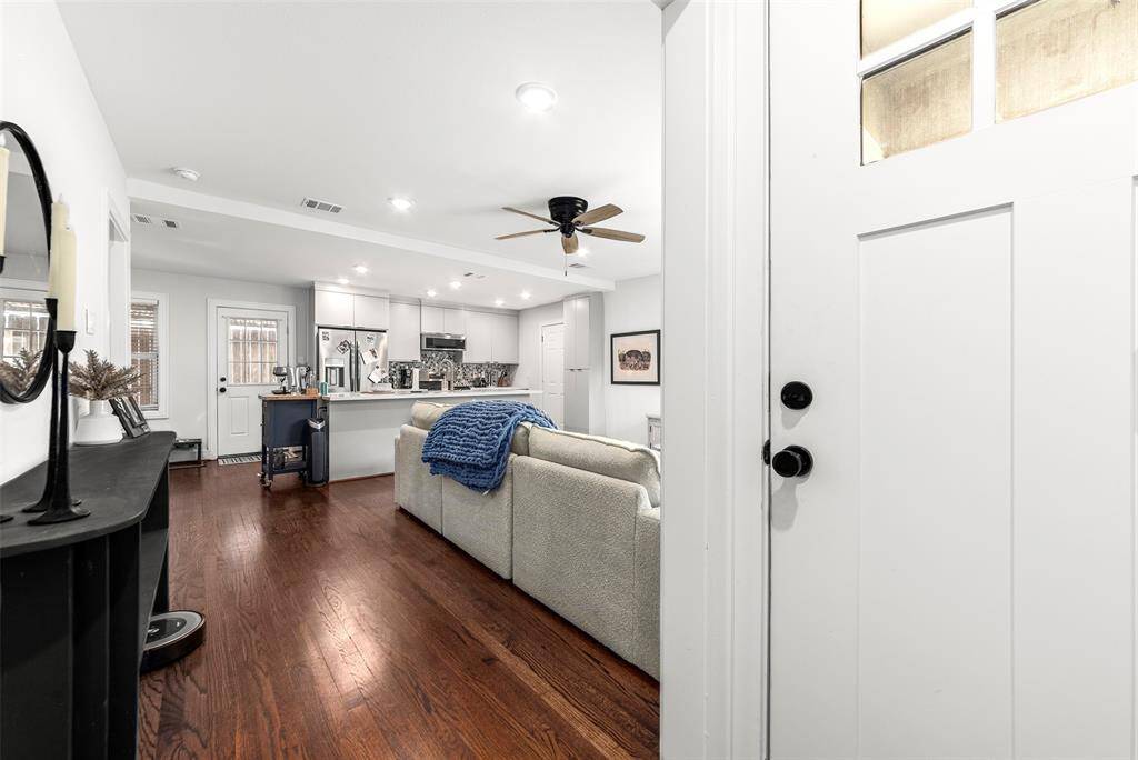 As you walk in you'll notice the spacious open floor plan and gorgeous hardwood floors.