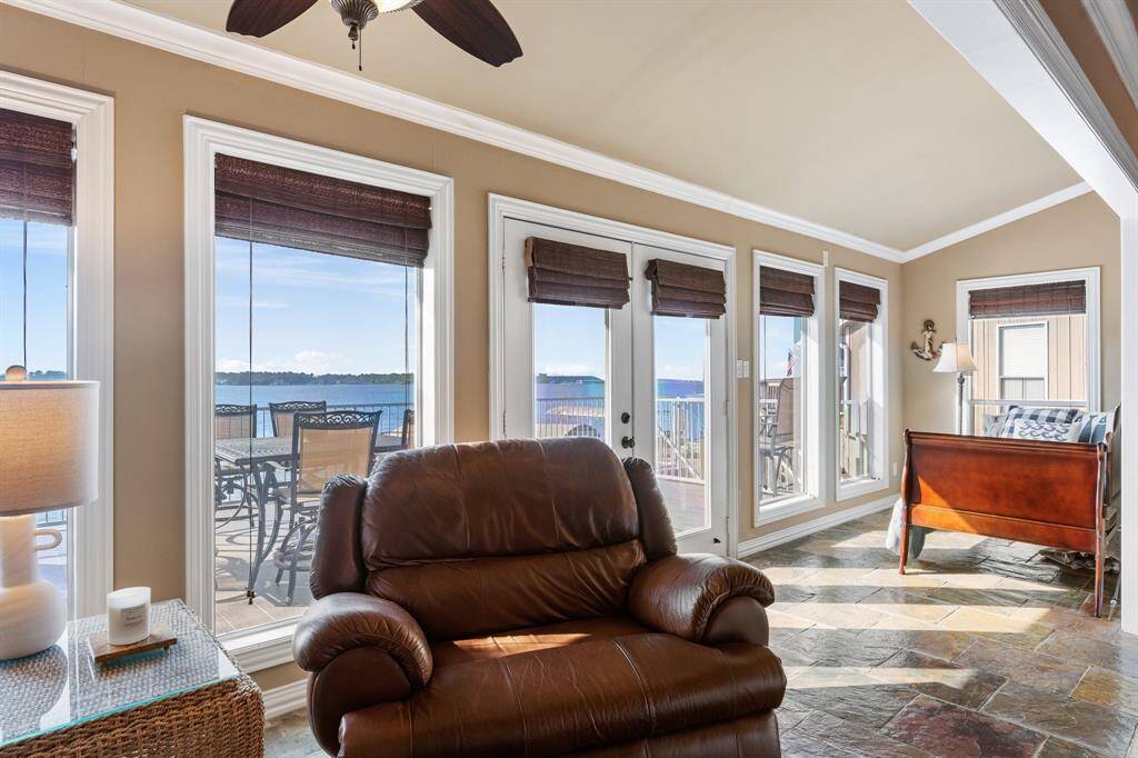 This is one of the enlarged areas. Plenty of room for an additional sleeping area taking in the lake, especially great for those large gatherings, Airbnb or a place to simply unwind. All of the windows have been replaced with lowEl status.