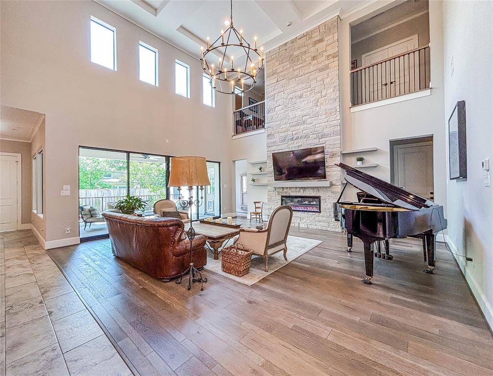 The extensive windows allow for tons of natural sunlight while the family rooms flows into the kitchen for the perfect entertaining floor plan!