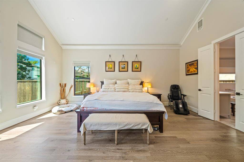 A first floor master bedroom with beautifulhardwoods, and serene views of thebeautiful pool and gardens.Lightening!