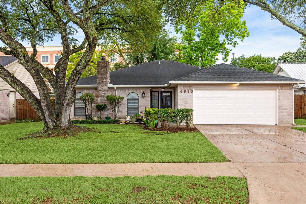 Charming single-story brick home with a well-maintained lawn & mature trees for great curb appeal.