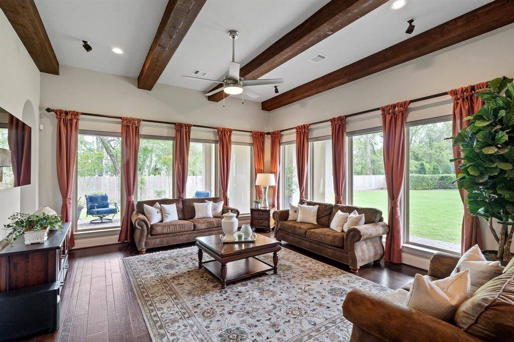 Stunning, cedar beams are a showstopper in the family room