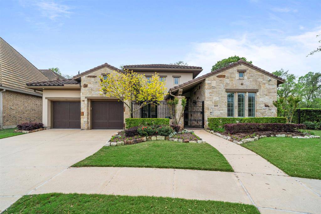 Exceptional curb appeal with stone and stucco elevation
