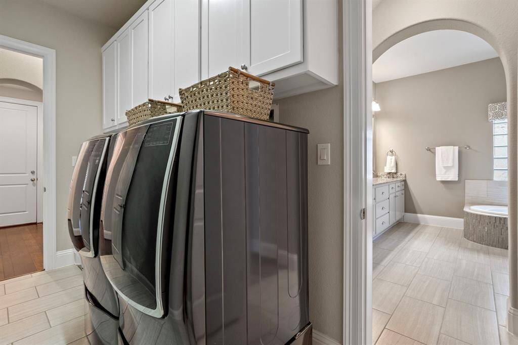 Utiity room conveniently located right off of primary bedroom