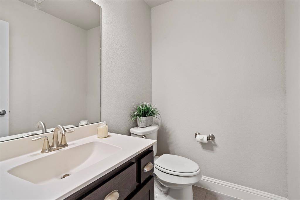 Half bathroom located on the second floor right outside media room