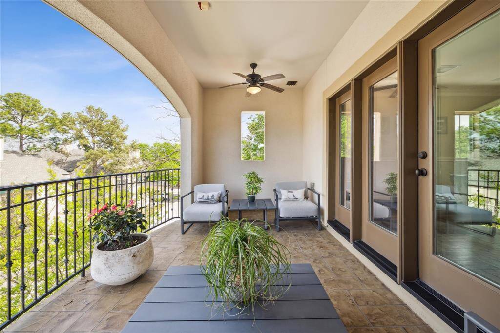 Large, covered third-floor balcony with two ceiling fans, making gatherings enjoyable and comfortable.