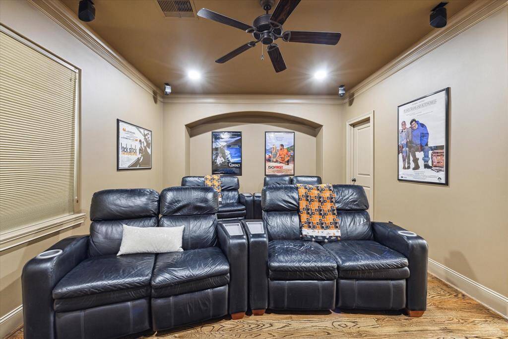 Third-floor bedroom with a walk-in closet, currently converted into a media room, but can easily be transformed back into a bedroom.
