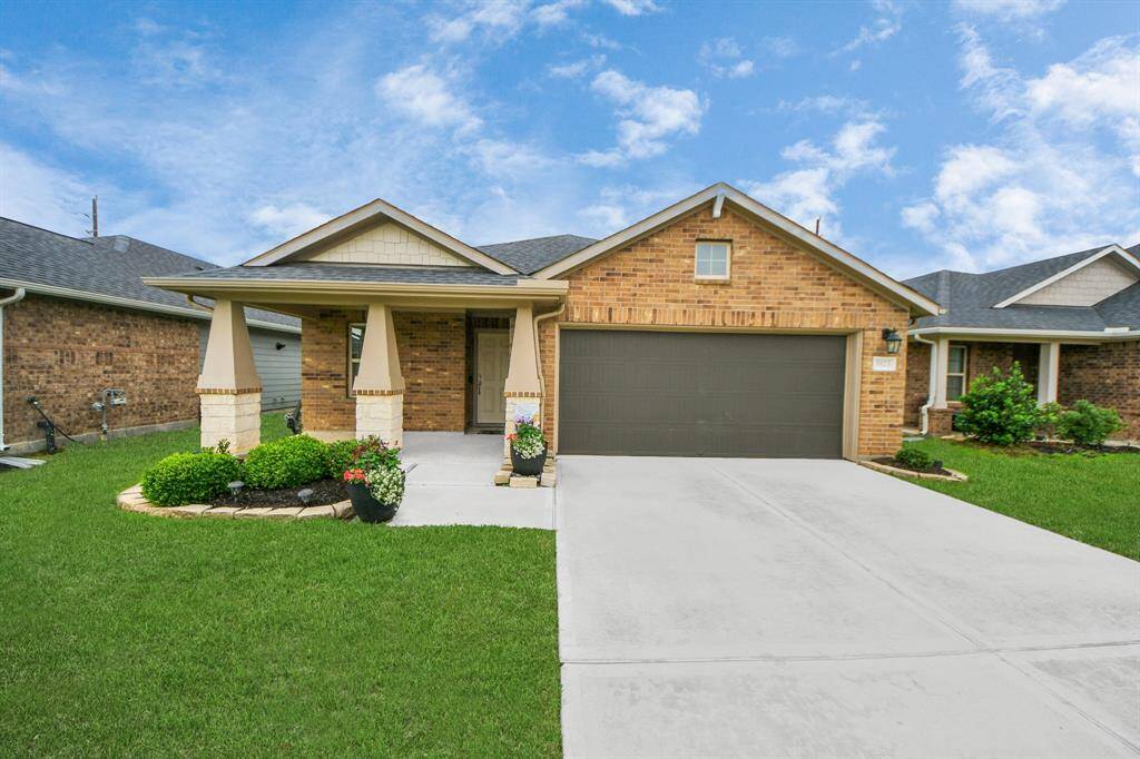 Approaching the front door you will see the beautiful brick elevation, lovely landscaping, and covered front porch.