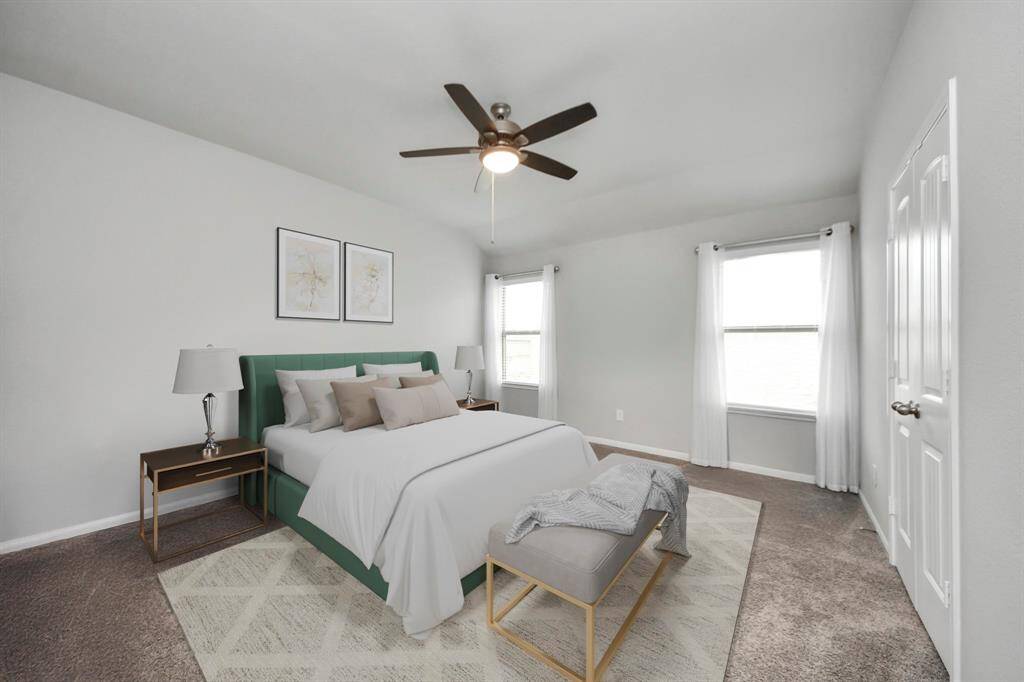 Step into the sanctuary of theprimary bedroom. Soft carpetingunderfoot adds a touch of luxury,creating a warm and invitingatmosphere that extends throughoutthe space.