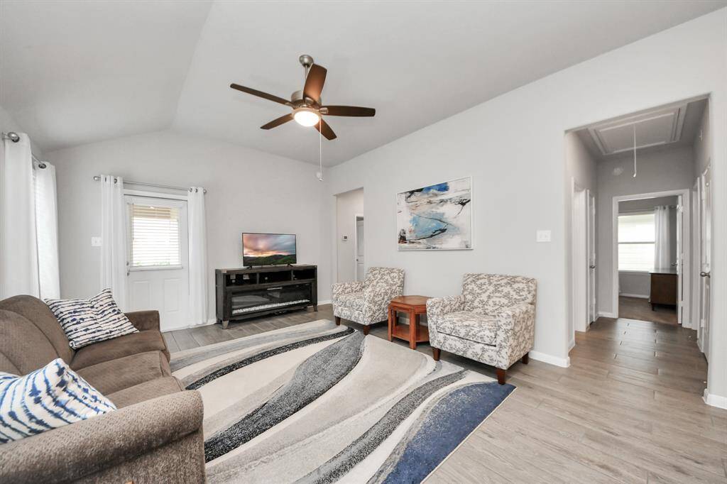 Another view of the bright andspacious living room.