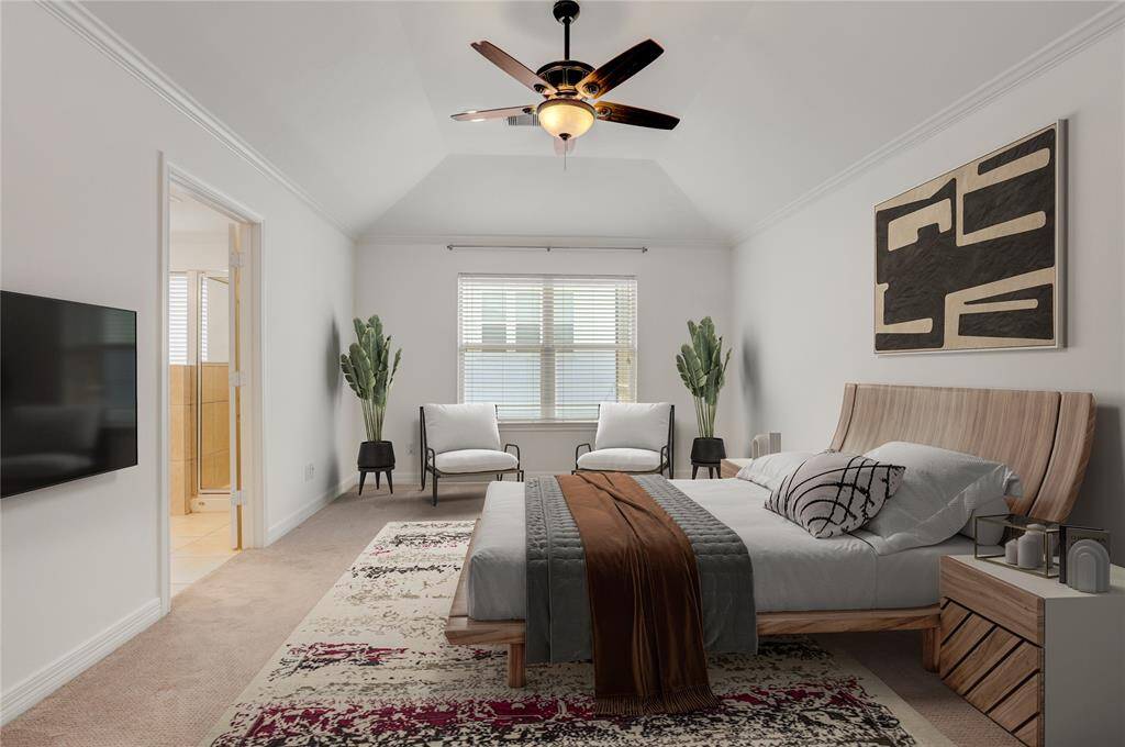 Enter into the spacious primary bedroom featuring soft carpet underfoot and a vaulted ceiling that adds height and dimension to the room. A large window brings in natural light, creating a bright and airy retreat. The ensuite bathroom is just steps away, offering convenience and comfort in your own private sanctuary. This photo is virtually staged.