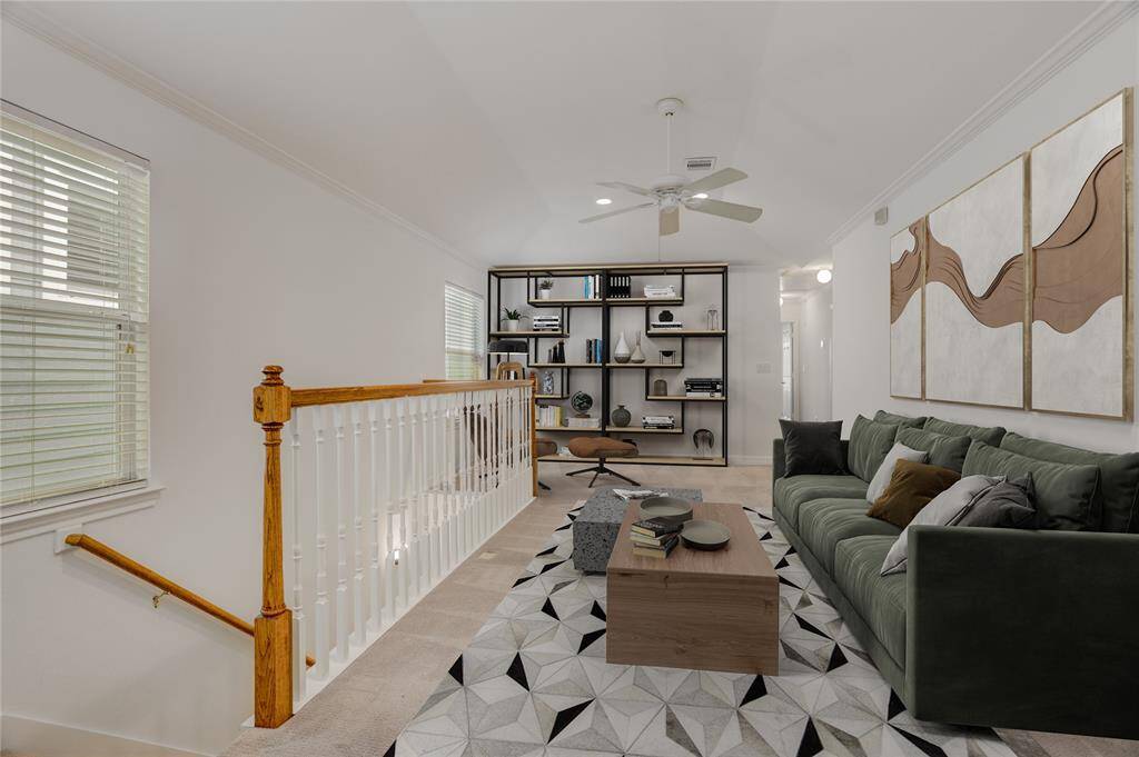 As soon as you reach the top of the stairs, you're welcomed by a spacious landing filled with natural light. This versatile area can easily function as a game room, reading nook, home office, or cozy media space—tailored to fit your lifestyle. This photo is virtually staged.