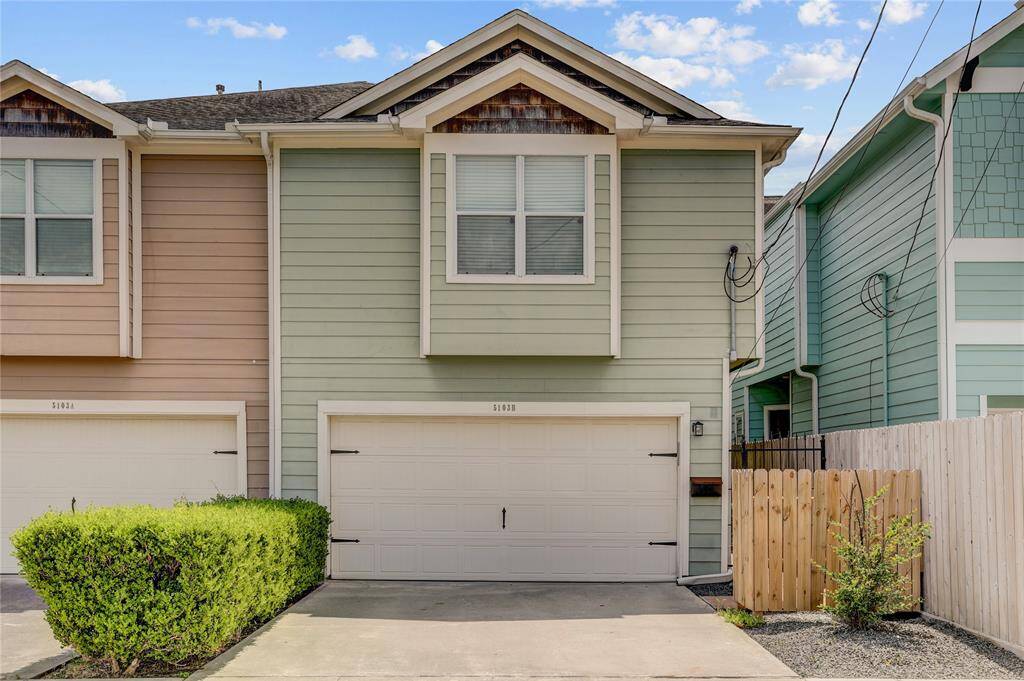 Here’s a closer look at 5103 Darling St #B. The soft green siding, accented with natural wood tones, gives the property a warm and welcoming curb appeal.