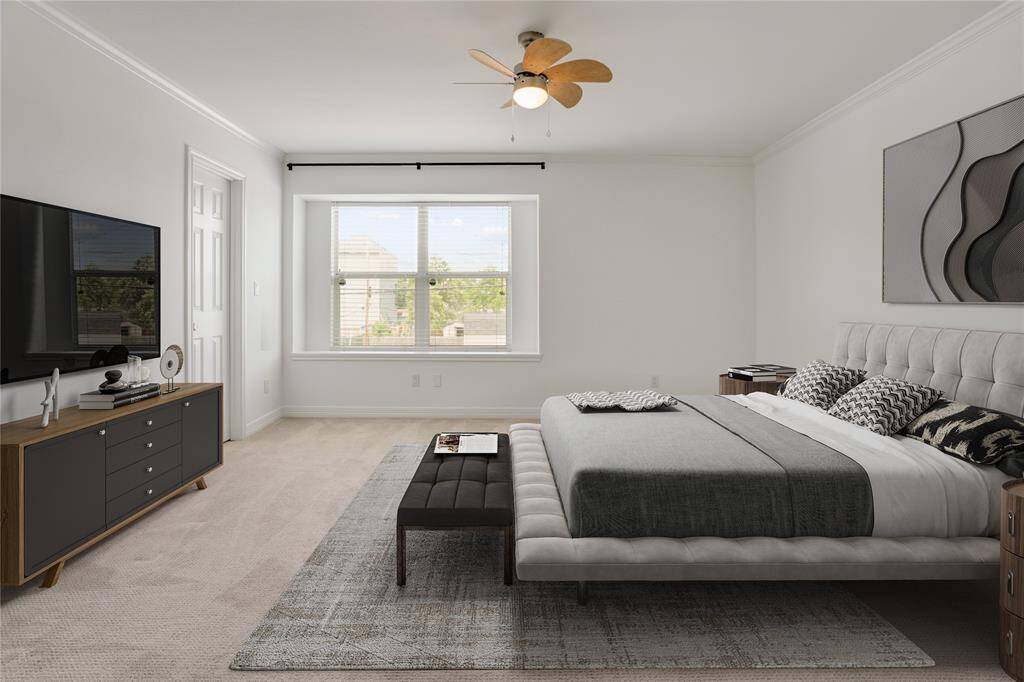 The third bedroom features generous proportions, soft carpet underfoot, and a peaceful atmosphere. A wide picture window invites in plenty of natural light and offers a pleasant view.  This photo is virtually staged.