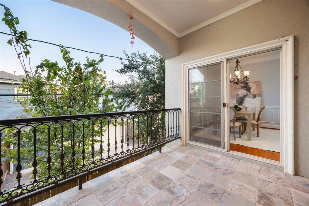 Take a step through the sliding glass door to your private, covered balcony, a great space for entertaining.